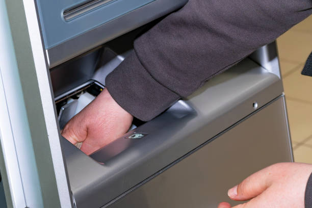 istock cash withdrawal from ATM. Close-up 2174366492