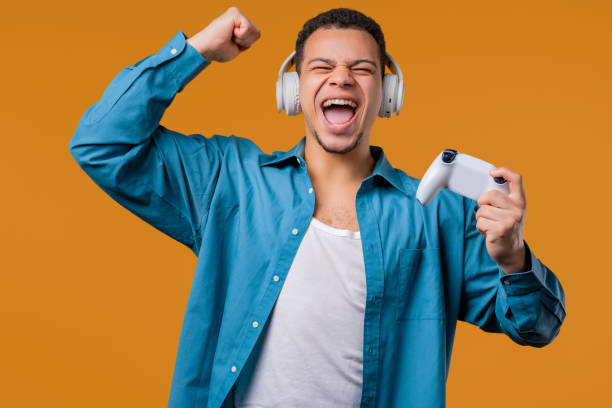istock Excited gamer man playing, winning online video game on console with joystick 2174367315