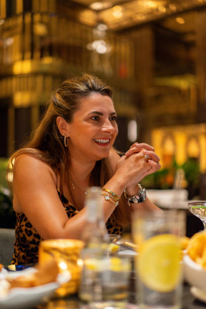 istock Beautiful woman drinking cocktail in restaurant. 2174367817