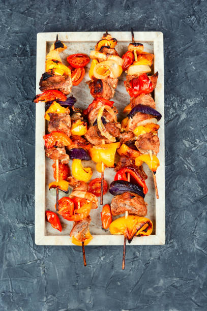 istock Barbecued meat with garnish. 2174368117