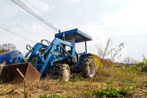 A tractor in a countryside garden during autumn