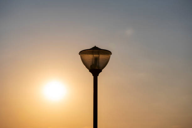 istock Street lighting-lantern. The sunset can be seen in the background. 2174370175