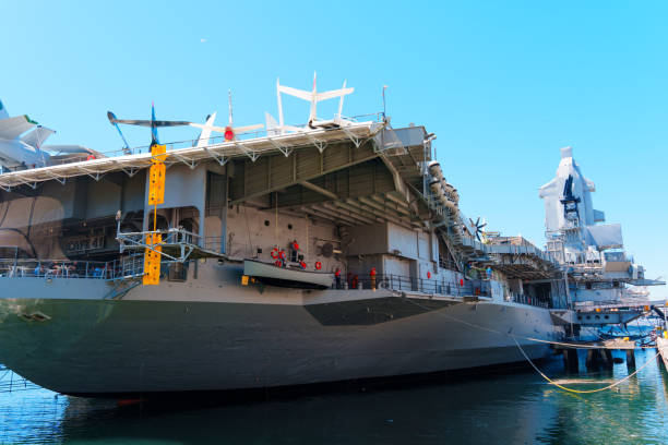 Tower of the USS Midway and an aircraft sitting on the deck