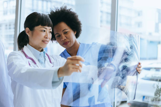 istock Doctors reviewing a lung X-ray image together 2174373951