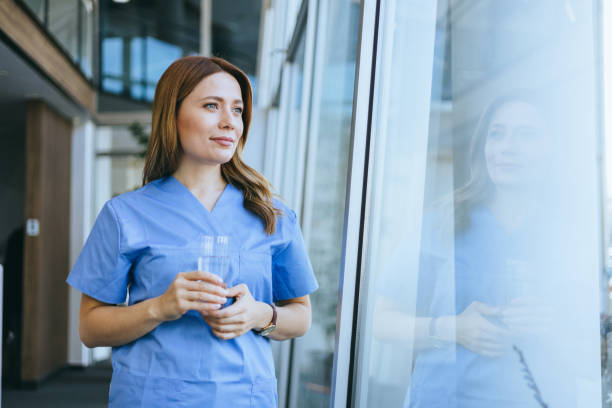 istock Nurse contemplating with a water bottle 2174374511