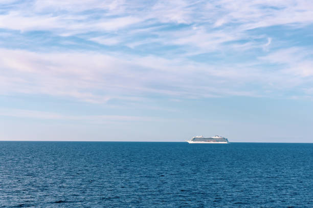 istock Seascape with a white ferry in the distance and waves. 2174375909