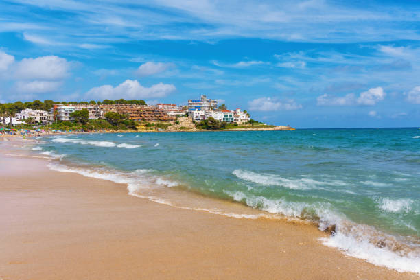 istock Serene Tarragona Beach Scene with Waves and Coastal Homes 2174377401