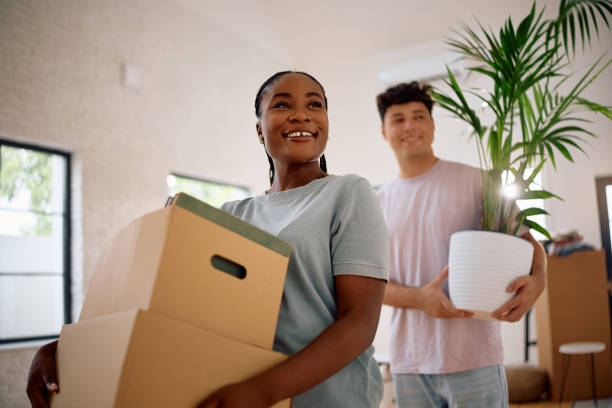 istock Happy multiracial couple moving into new apartment. 2174378350