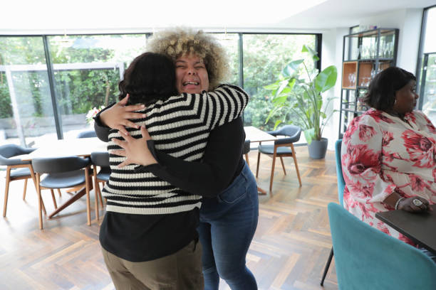 istock Cheerful women hugging each other 2174382540