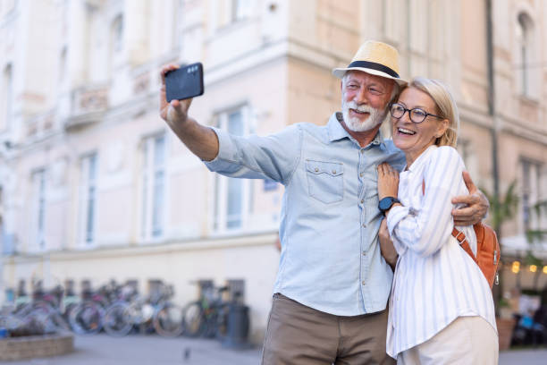 istock Elderly couple taking a selfie and enjoying urban exploration. 2174386069