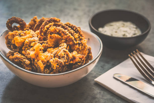 istock Fried Octopus  tentacles in a bowl with tartar sauce on the side 2174391260