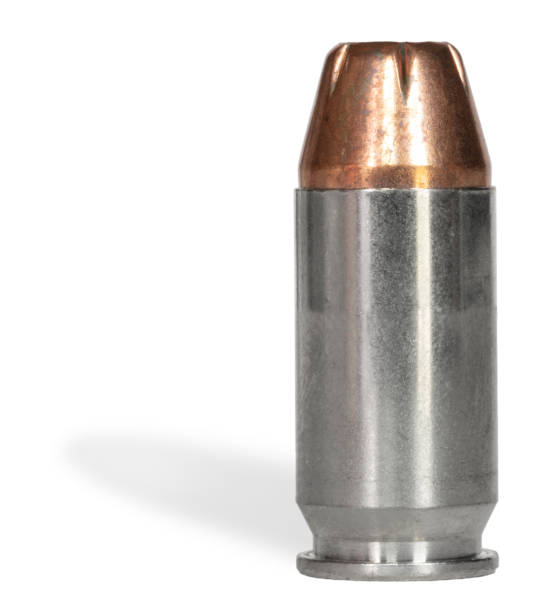 Drop shadow behind a silver colored cartridge with a copper plated hollow point bullet that runs in a 45 caliber semi-auto pistol.