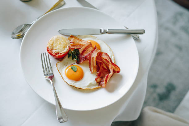 Plate with tasty breakfast isolated on white background