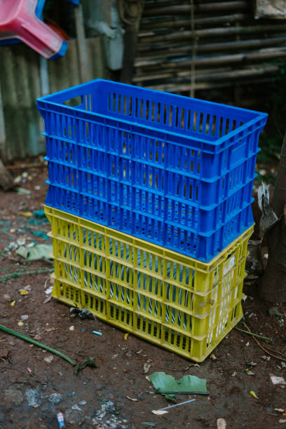 Blue and yellow square basket designed for carrying plates, ideal for organizing kitchenware