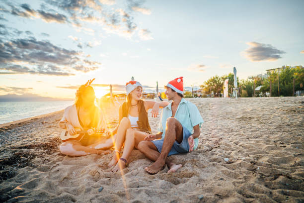 istock Group of friends spending Christmas at the beach 2174401997