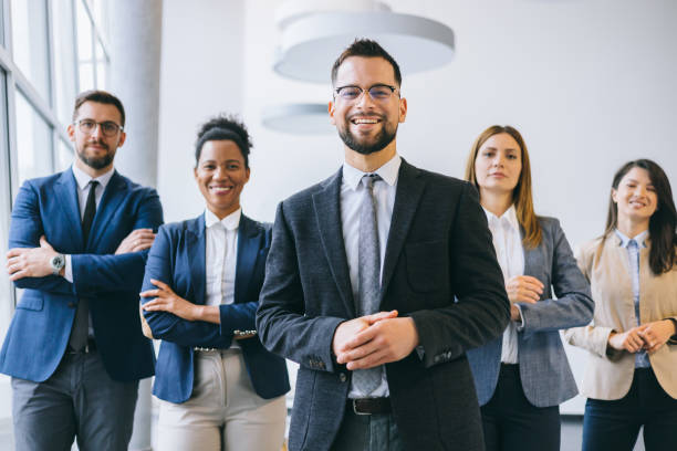 istock Welcoming business professional with team 2174402478