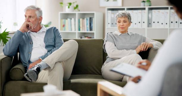 istock Therapy, argument and couple on sofa for counseling session, consulting and advice in office. Psychology, meeting and man and woman on couch for marriage crisis, relationship and communication issue 2174403901