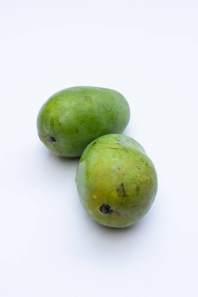 istock Fresh mango fruit on a white background, highlighting its vibrant yellow color and smooth texture, perfect for food photography and advertising 2174404556