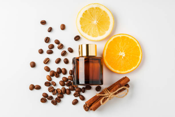istock Aromatic display of citrus fruits, coffee beans, cinnamon sticks, and diffuser on a clean white surface 2174404663