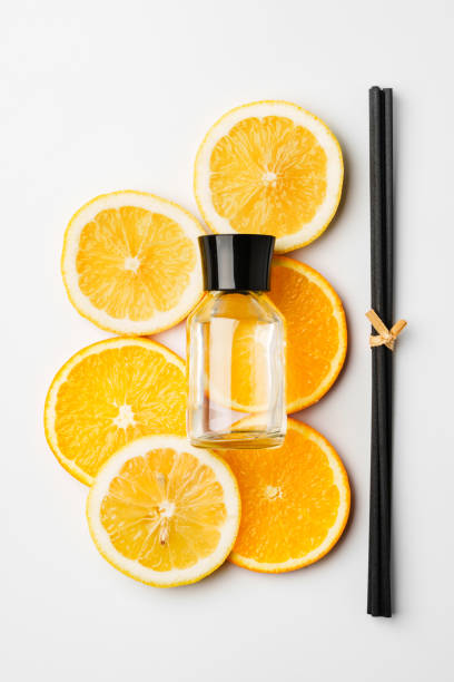 istock Aromatic display of essential oils with citrus fruit and chopsticks on a minimalist background 2174404668