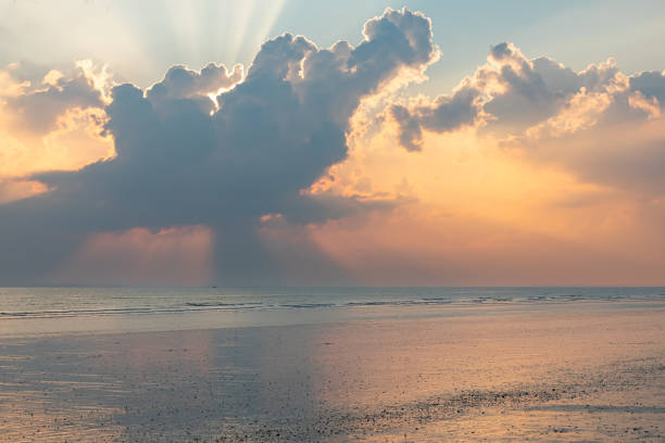 A dramatic sunset sky at low tide.
