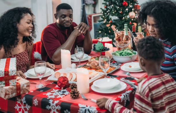 istock Black Family Christmas Dinner Celebration 2174405866