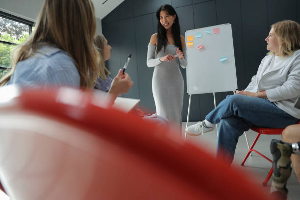 istock Woman presenting during meeting 2174405906