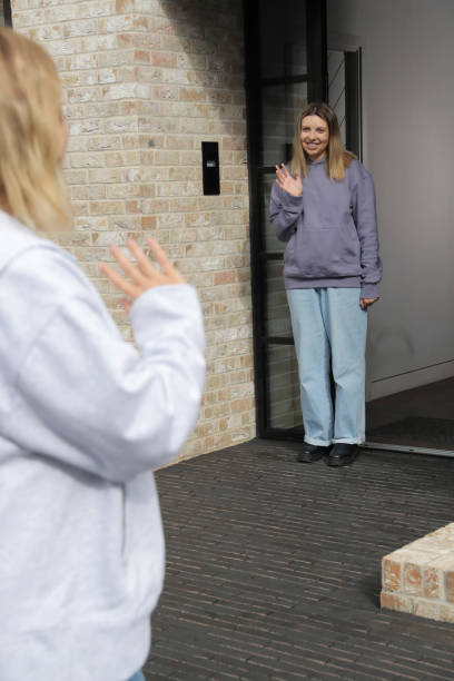 istock Women waving bye to each other 2174406096