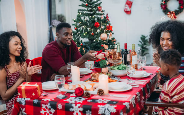 istock Black Family Christmas Dinner Celebration 2174406406