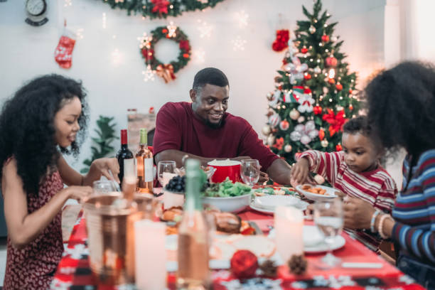 istock Black Family Christmas Dinner Celebration 2174406863