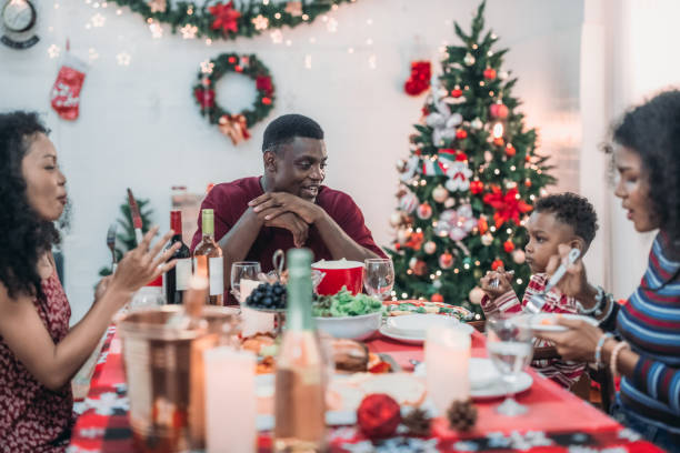 istock Black Family Christmas Dinner Celebration 2174407070