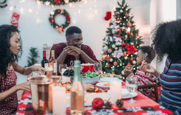 istock Black Family Christmas Dinner Celebration 2174407084