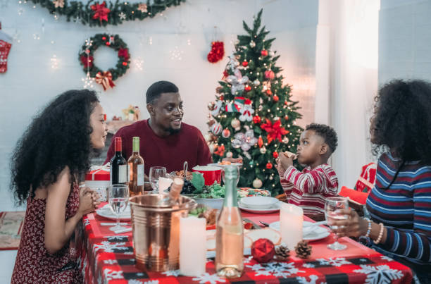 istock Black Family Christmas Dinner Celebration 2174407262