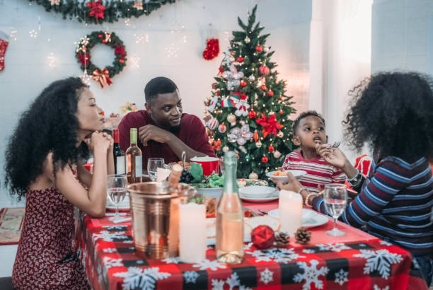 istock Black Family Christmas Dinner Celebration 2174407660