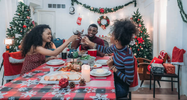 istock Black Family Christmas Dinner Celebration 2174407910