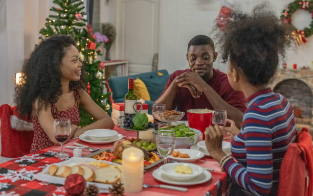 istock Black Family Christmas Dinner Celebration 2174407947