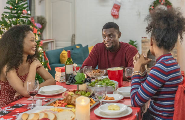 istock Black Family Christmas Dinner Celebration 2174408203
