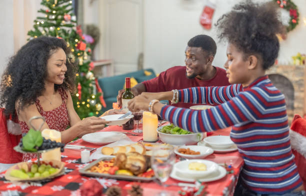 istock Black Family Christmas Dinner Celebration 2174408451