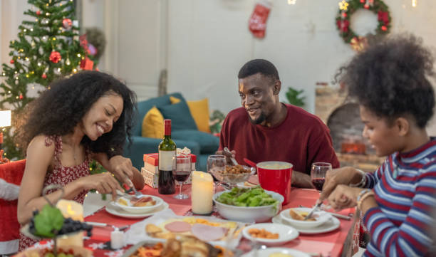 istock Black Family Christmas Dinner Celebration 2174409308