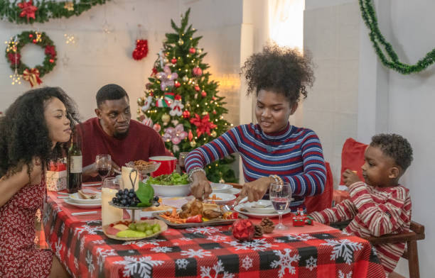 istock Black Family Christmas Dinner Celebration 2174410352