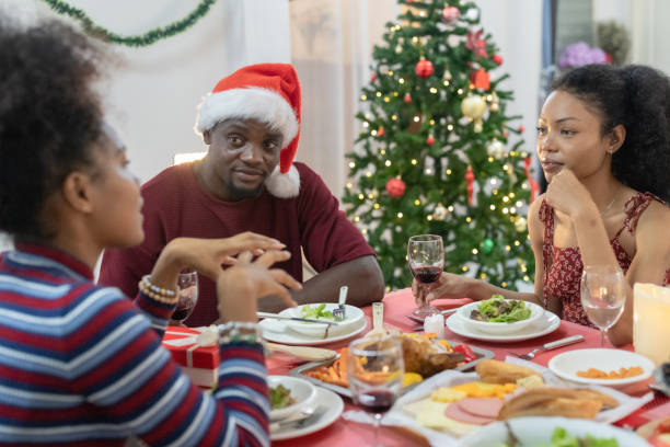 istock Black Family Christmas Dinner Celebration 2174411264