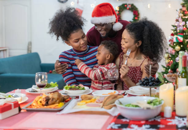 istock Black Family Christmas Dinner Celebration 2174411877