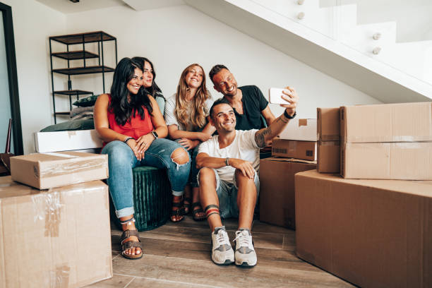 istock friends moving house and take a selfie 2174415354