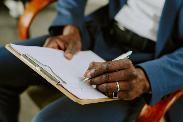 istock Taking Notes on Clipboard During Business Meeting 2174415795