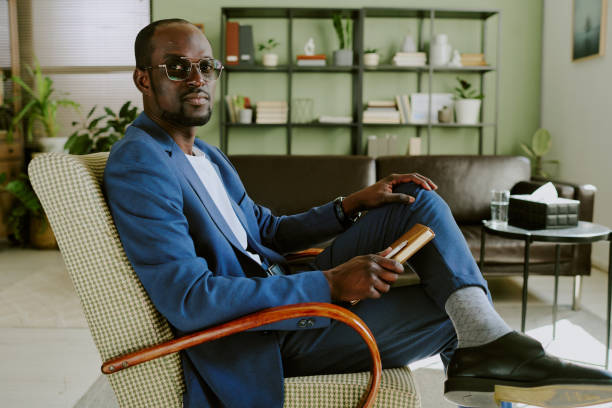 istock Holding Coffee Cup While Sitting in Stylish Office Chair 2174415928