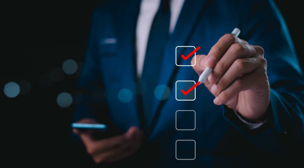 istock Business performance checklist, businessman using laptop doing online checklist survey, filling out digital form checklist, take an assessment, questionnaire, evaluation, online survey, online exam. 2174416409