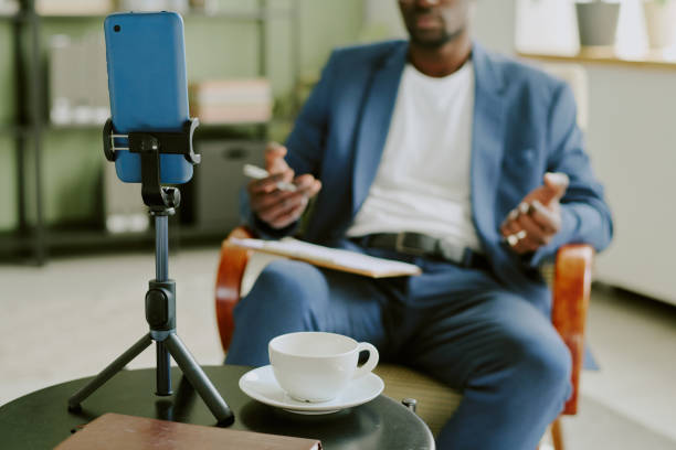 istock Conducting Online Meeting with Smartphone on Tripod 2174418702
