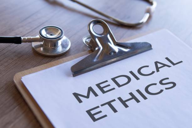 istock Paper clipboard with text MEDICAL ETHICS and stethoscope. 2174420157