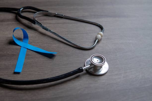 istock A blue ribbon and a stethoscope placed on a wooden surface. 2174420191
