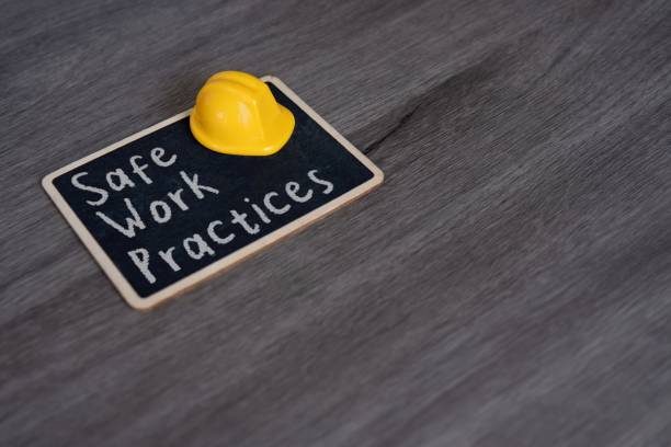 istock Small chalkboard with the text Safe Work Practices and yellow hard hat. 2174420245